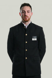 Japanese school uniform Classic Gakuran: black stand-collar jacket with a row of gold buttons worn over a white shirt with matching black trousers