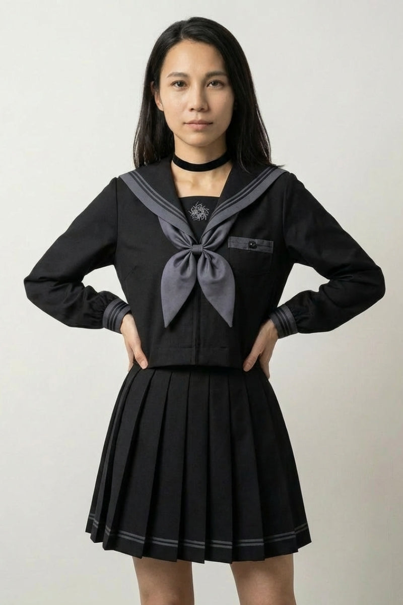 Japanese school uniform Midnight Sailor: all-black seifuku top and pleated skirt with grey-toned collar lines and a soft grey scarf at the chest