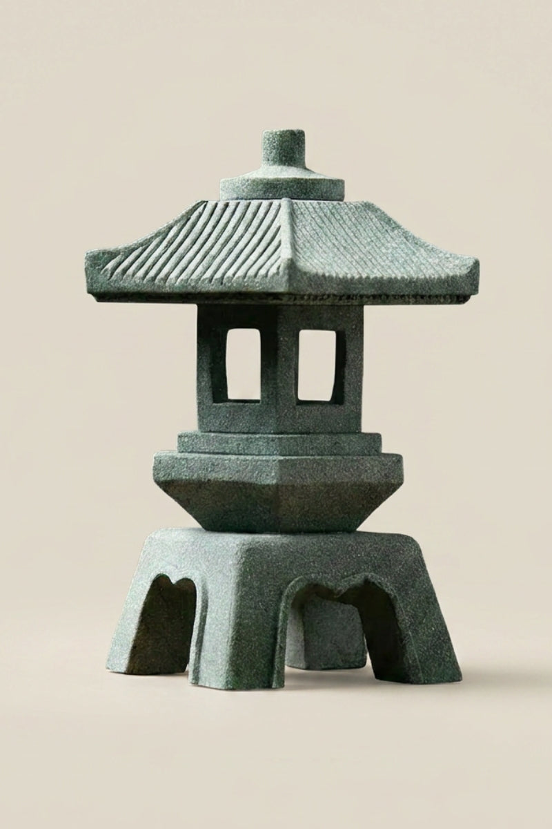 Japanese stone outdoor lantern — Japanese stone garden lantern, a green weathered stone garden lantern with a pagoda roof and open light chamber