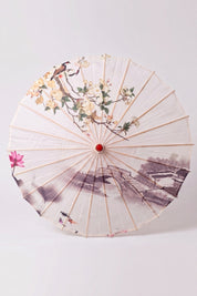 Traditional Japanese paper umbrella with a flowering branch, a pink lotus and a misty stone bridge on an off-white ground, shown open on bamboo ribs