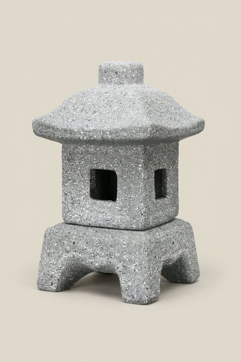 Japanese Zen garden lantern — Japanese stone garden lantern, a grey stone garden lantern with a pagoda roof and arched legs, traditional toro