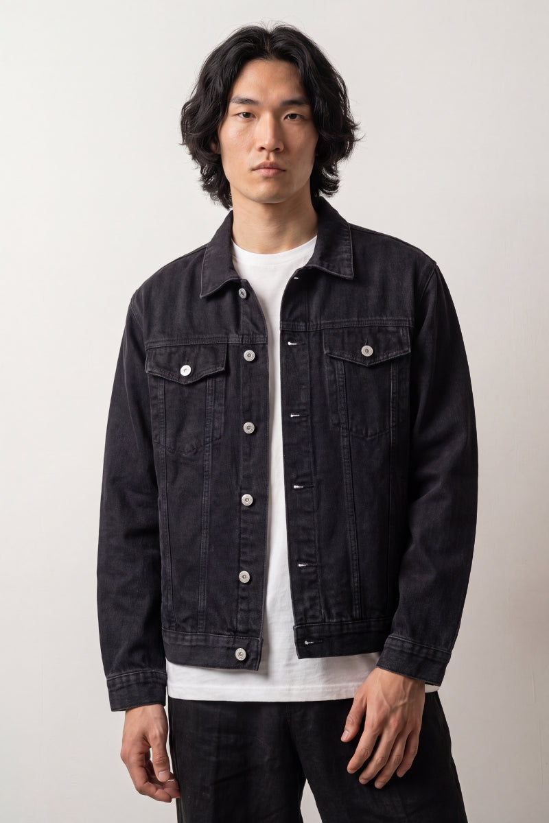 Koi carp embroidered denim jacket worn on model, relaxed unisex fit with button front and chest flap pockets