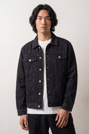 Koi carp embroidered denim jacket worn on model, relaxed unisex fit with button front and chest flap pockets