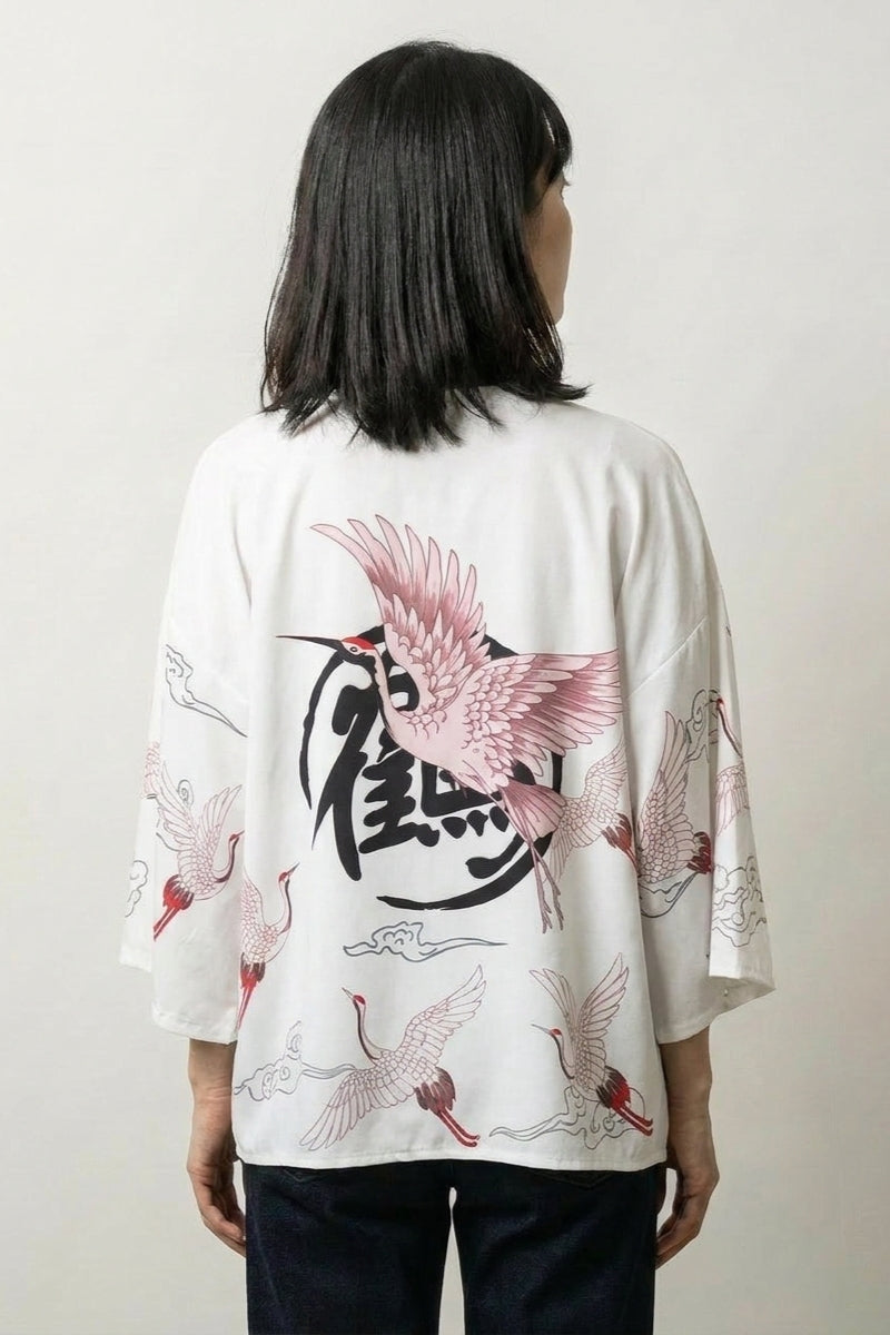 Back view of the white Haruko kimono jacket, the red bird and circular seal with cranes scattering toward the sleeves