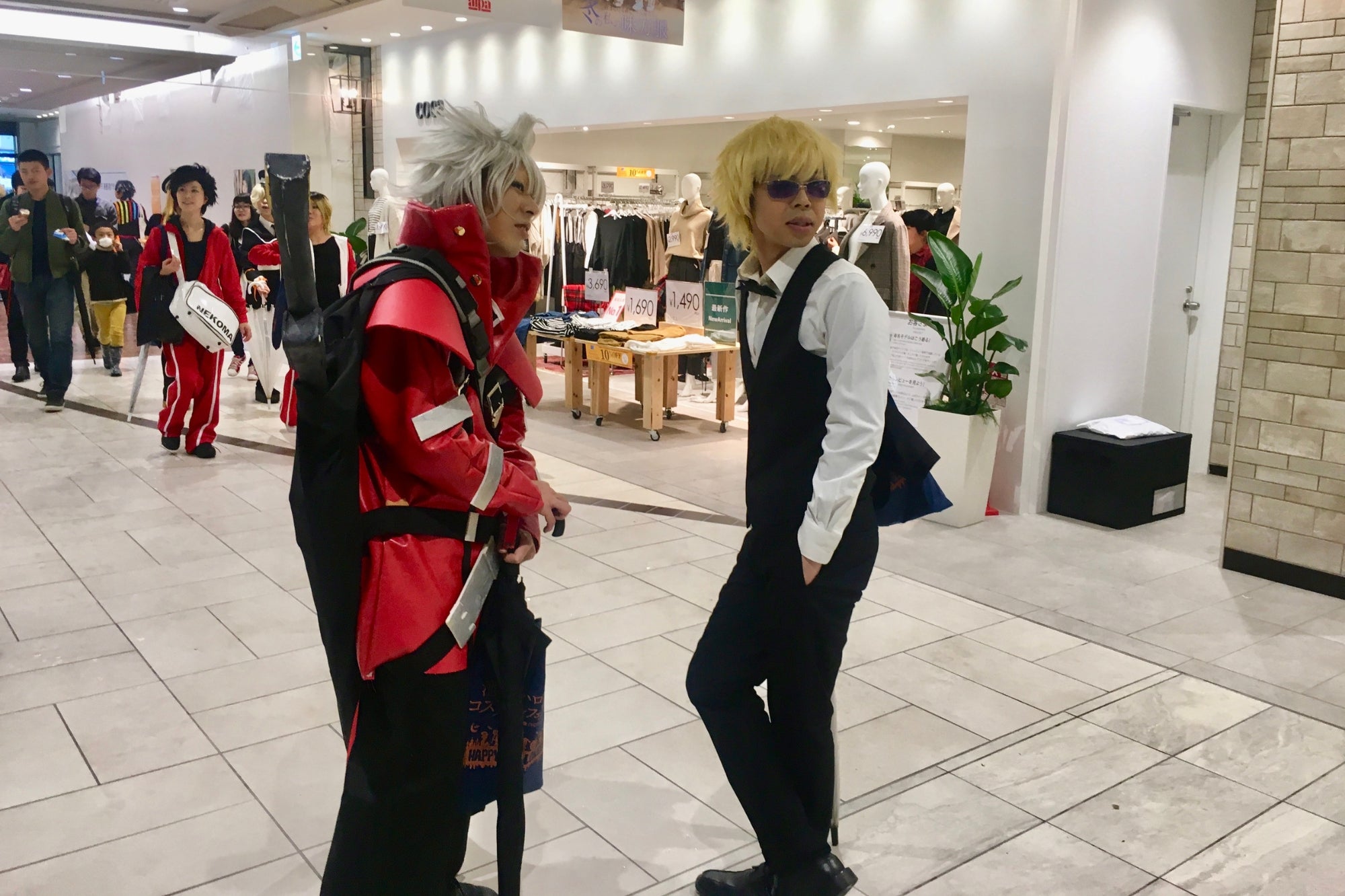 Cosplayers dressed as anime characters inside a Kyoto shopping mall, reflecting Japan’s modern pop culture and creativity in the Japan Clothing Lookbook.