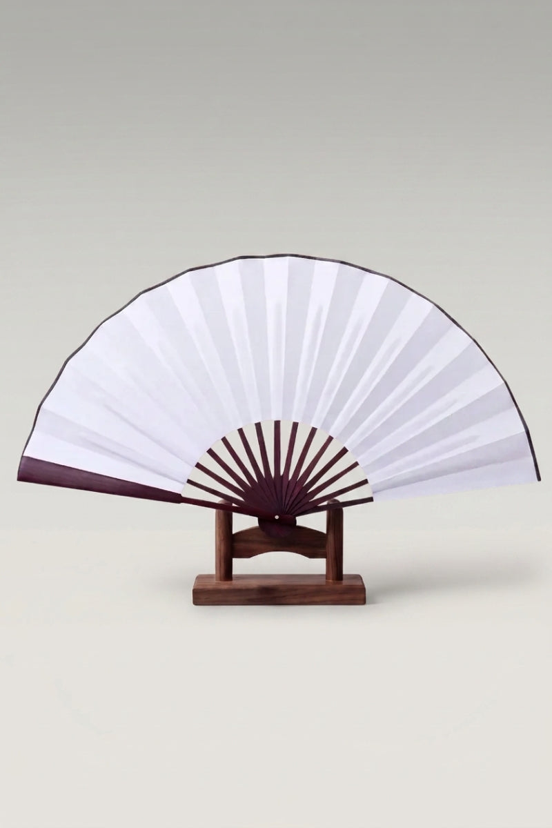 Large Japanese folding fan 'Kisho' — an oversized plain white leaf on a large bamboo folding fan, shown open on a wooden stand