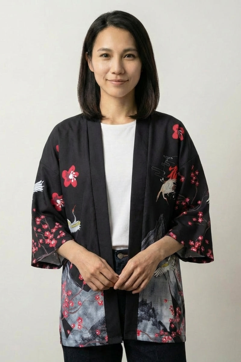 Lightweight kimono jacket Edo in black, front view: the same red plum blossom and crane print turned graphic against the dark ground
