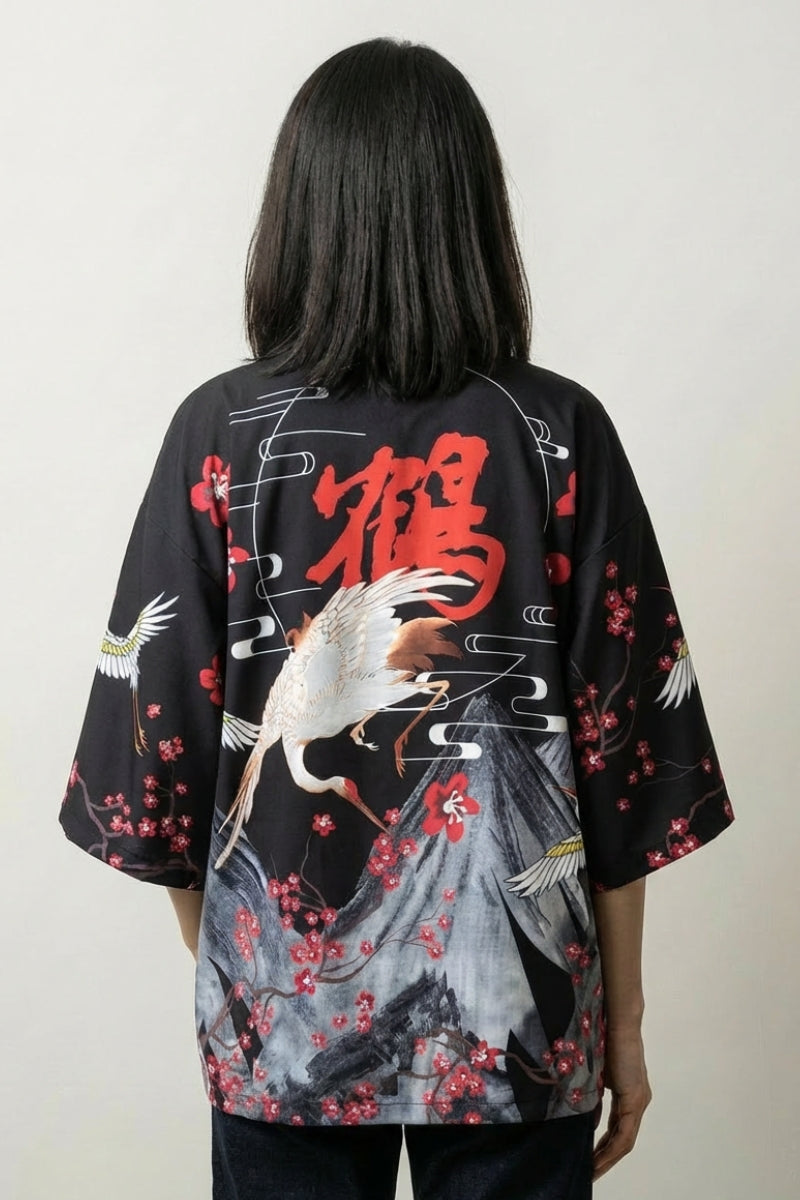 Back view of the black Edo kimono jacket, the crimson blossom and crane reading loud against black