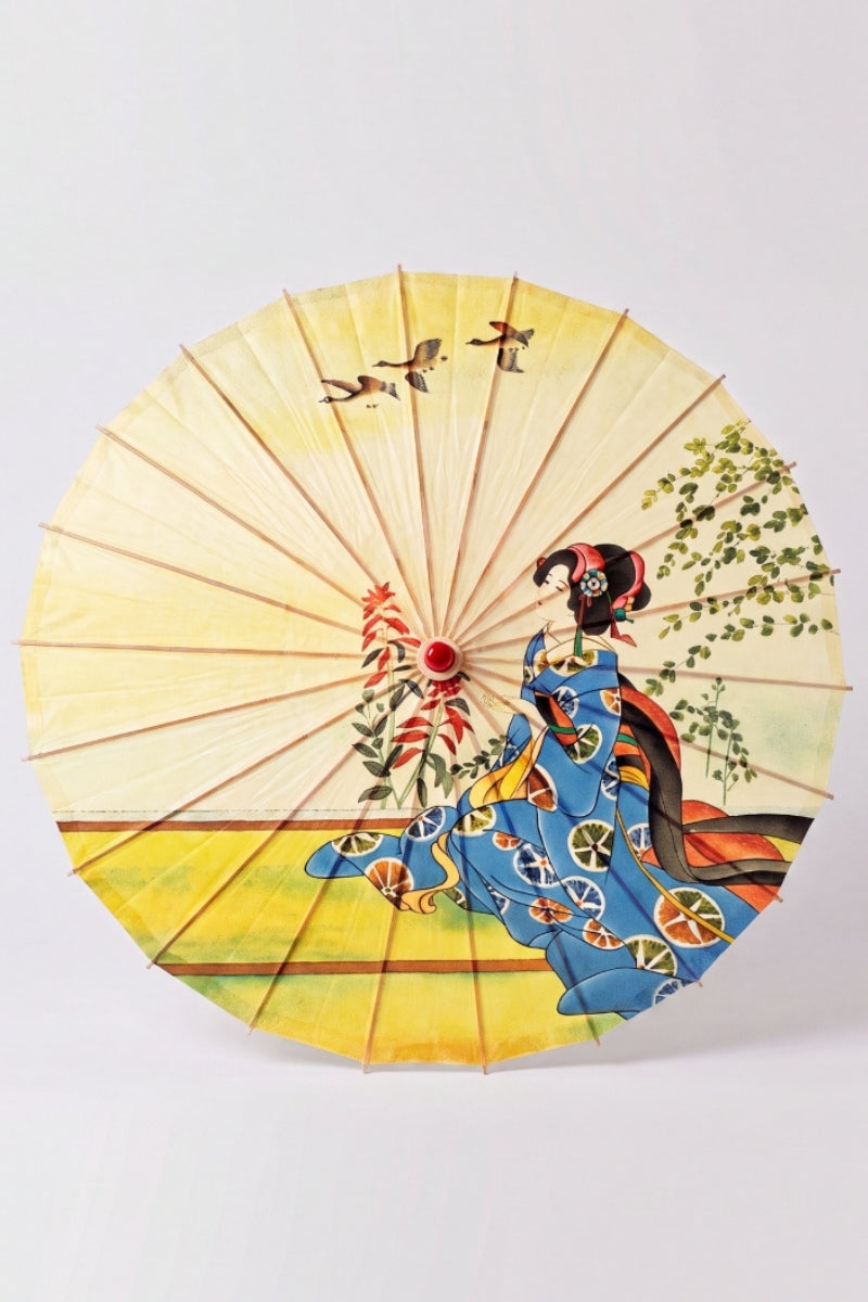 Traditional Japanese paper umbrella with a woman in a blue kimono kneeling under wild geese on a pale yellow ground, shown open on bamboo ribs