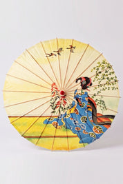 Traditional Japanese paper umbrella with a woman in a blue kimono kneeling under wild geese on a pale yellow ground, shown open on bamboo ribs