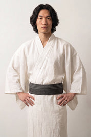Heathered dark gray obi belt with pale dotted stripes, worn over a white kimono