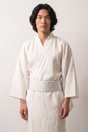 Off-white pale gray obi belt scattered with fine gray dashes, worn over a white kimono