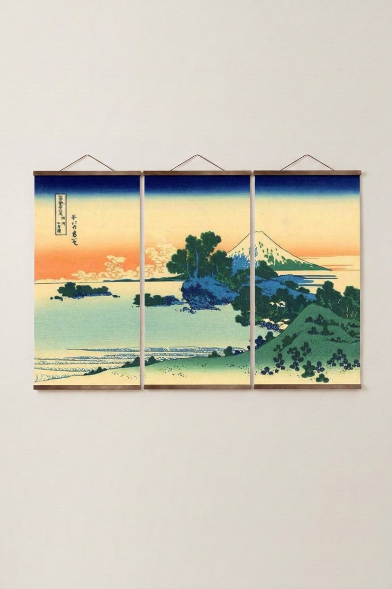 Japanese Triptych Painting 'Aka Machi' — Japanese ukiyo-e-style print depicting a coastal sunset with Mount Fuji across turquoise water, as a three-panel triptych wall art, shown on a wall