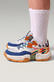 White Japanese-style sneakers 'Tsuruga', worn on foot with white socks — Japanese streetwear style