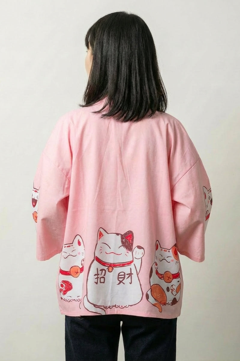 Back view of the pink Maneki Neko kimono cardigan: the lucky cat with paw raised beside the gold and red kanji for wealth and fortune
