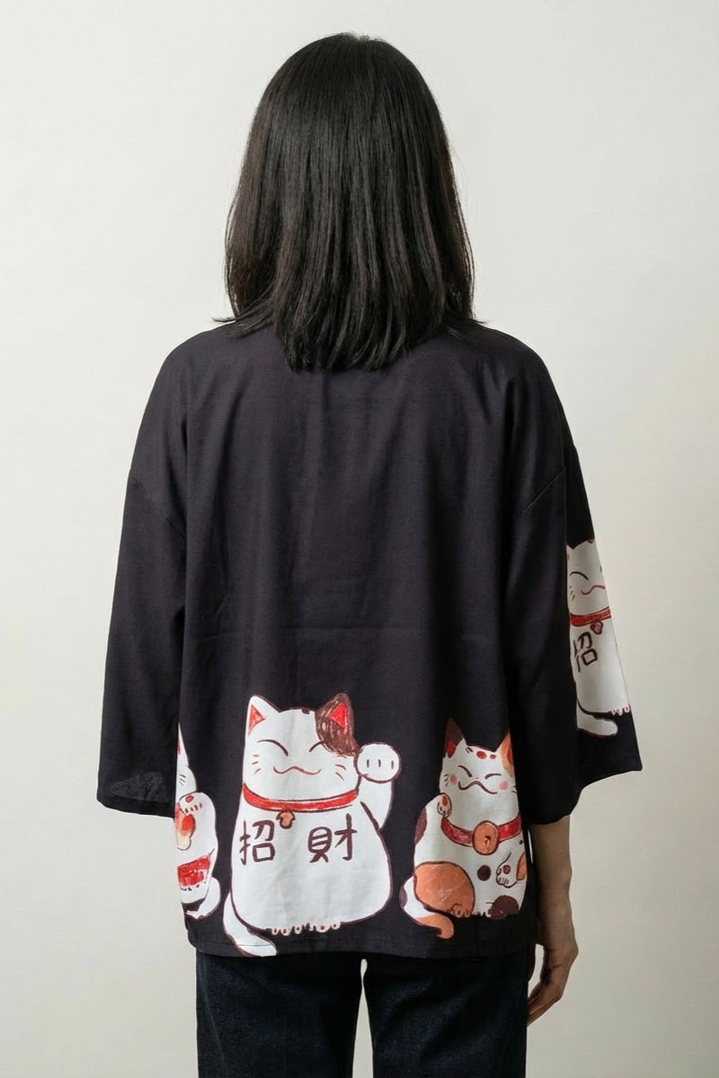 Back view of the black Maneki Neko kimono cardigan, the beckoning cat and fortune characters bright against the dark ground
