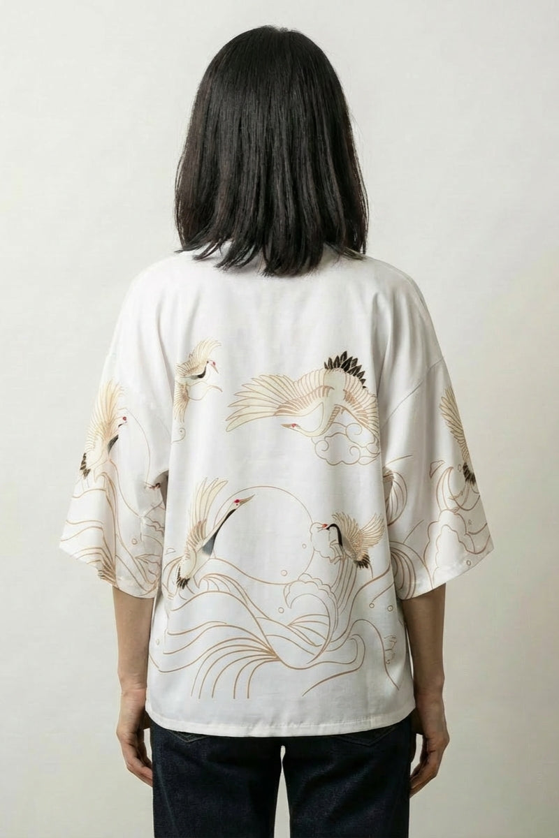 Back view of the white Setsuko short kimono, the gold-line waves and cranes crisp against the pale ground
