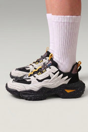 White Japanese designer sneakers 'Shinshiro', worn on foot with white socks — Japanese streetwear style