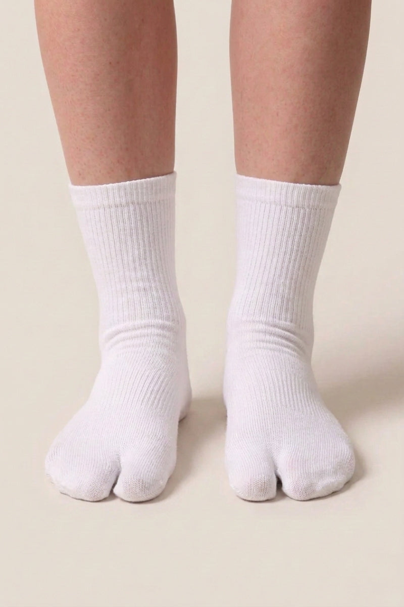 Tabi socks in white cotton, a pair of Japanese split toe socks for men and women, shown at crew height with the two toe division made for geta and zori sandals