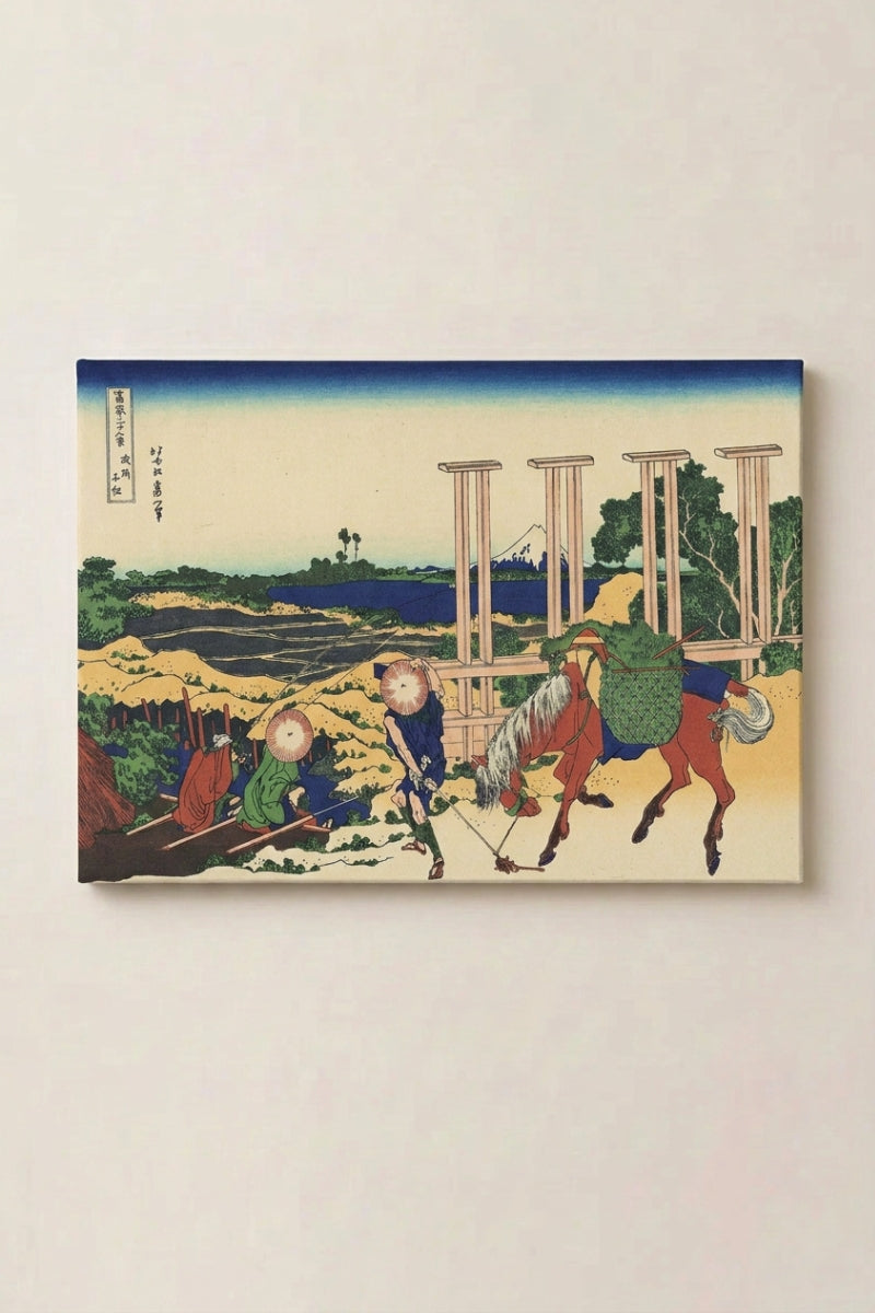 Japanese print Horse 'Umakishi' — Japanese ukiyo-e-style print depicting travellers with a horse passing a torii gate, ukiyo-e canvas print, shown on a wall