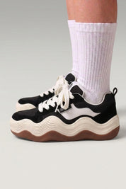 Black chunky platform sneakers 'Nami', worn on foot with white socks — Japanese streetwear style