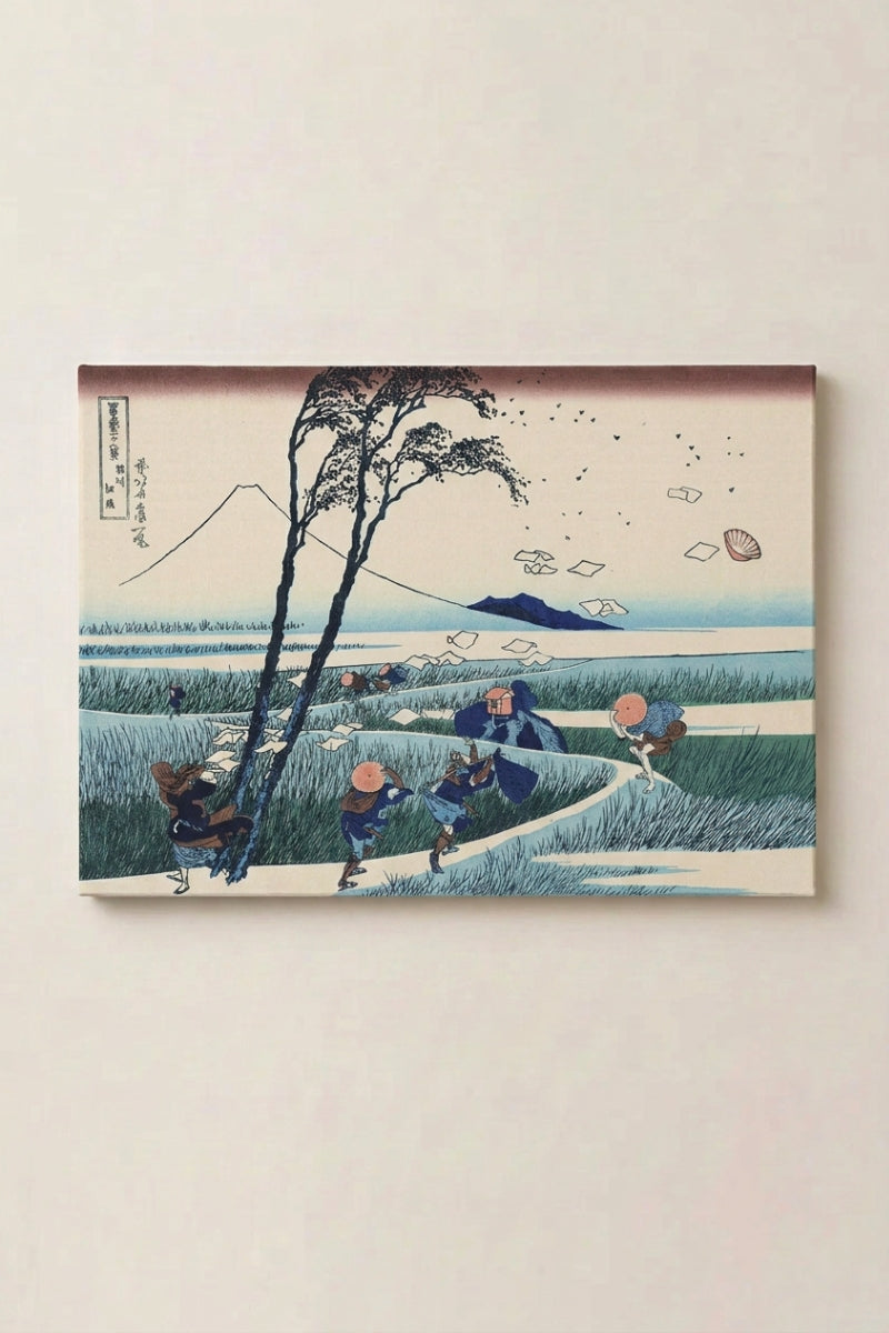 Japanese Autumn Print 'Kazega' — Japanese ukiyo-e-style print depicting travellers in a windswept rice field with scattering papers and Mount Fuji, ukiyo-e canvas print, shown on a wall
