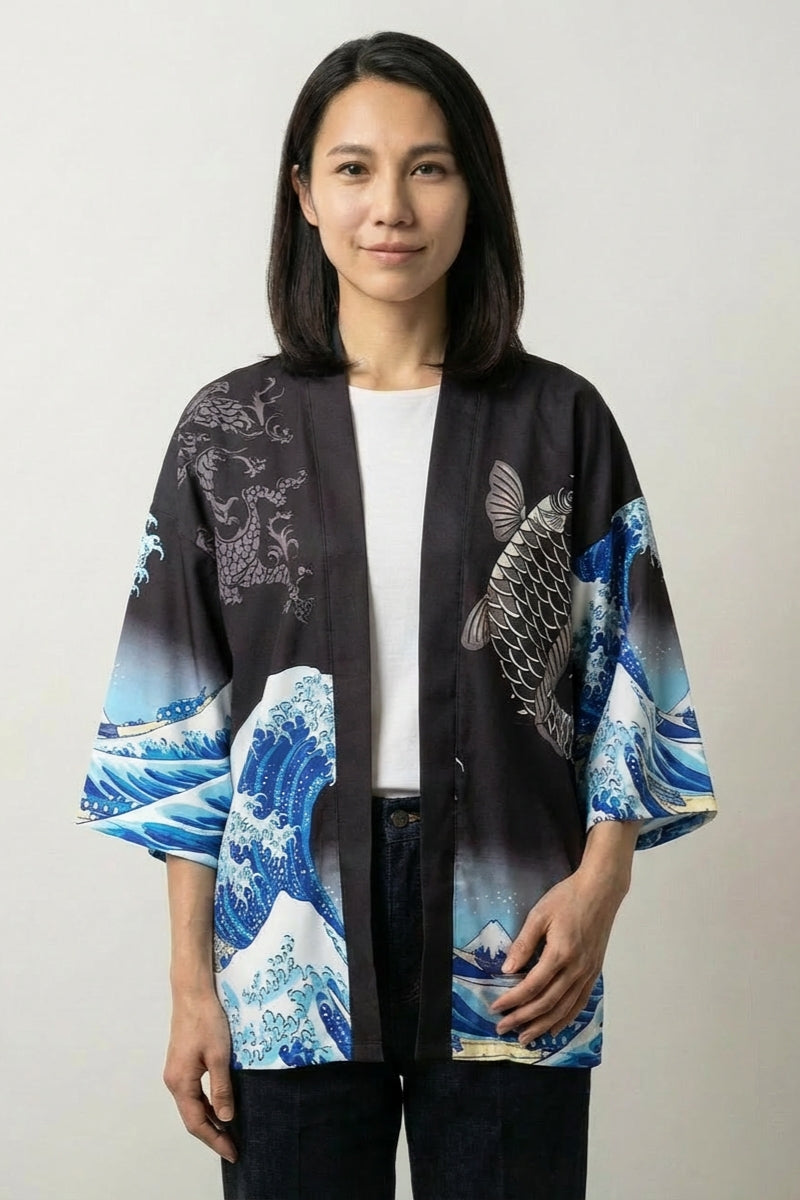Women's kimono blouse Kanagawa in black, front view: the same koi and great-wave motif glowing against a dark satin-finish ground