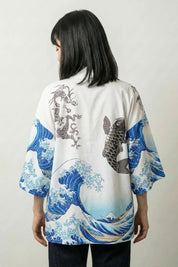 Back view of the white Kanagawa kimono blueprint: the koi climbing through the crest of the wave with a flowering branch arcing overhead
