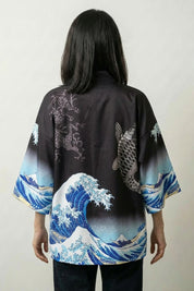 Back view of the black Kanagawa kimono blouse, the blue wave and inky koi carp set against the dark ground