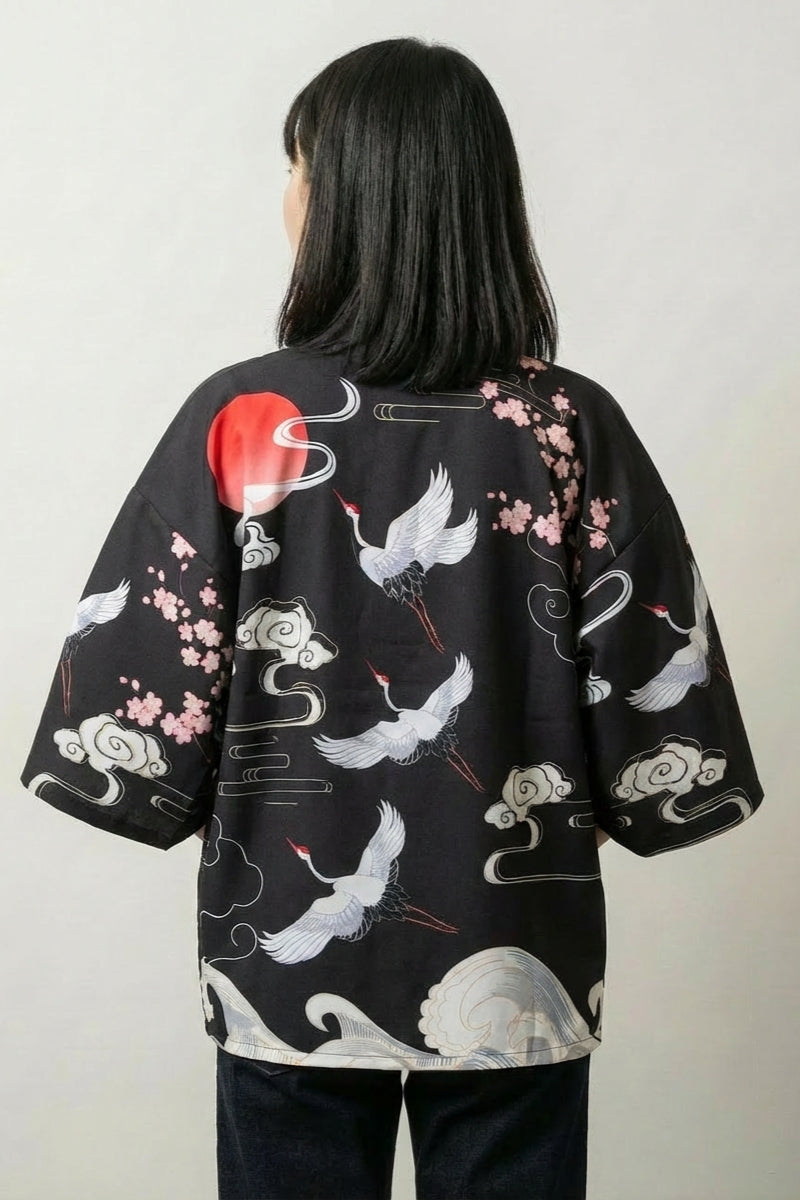 Back view of the Osaka kimono jacket: white cranes gliding beneath a red rising sun among soft clouds and pale plum blossom on deep black