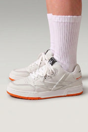 Orange Japanese street sneakers 'Inazuma', worn on foot with white socks — Japanese streetwear style