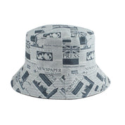 Detail of newspaper print on 90s vintage bucket hat — Y2K Tokyo, gaultier newsprint cotton alternative