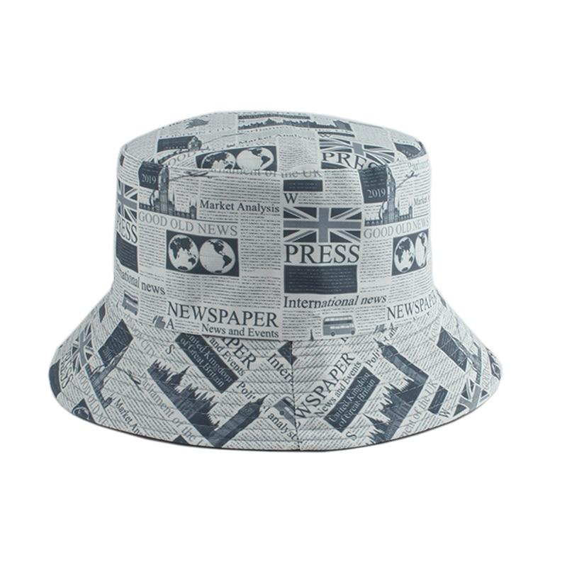Detail of newspaper print on 90s vintage bucket hat — Y2K Tokyo, gaultier newsprint cotton alternative