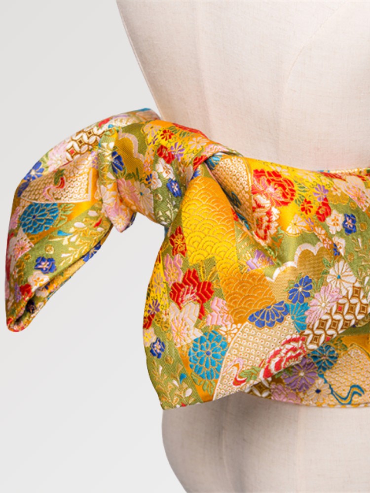 Beautiful yellow kimono obi belt for women in a traditional Japanese pattern