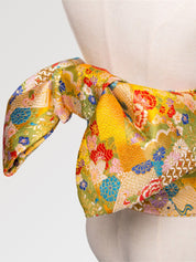 Beautiful yellow kimono obi belt for women in a traditional Japanese pattern