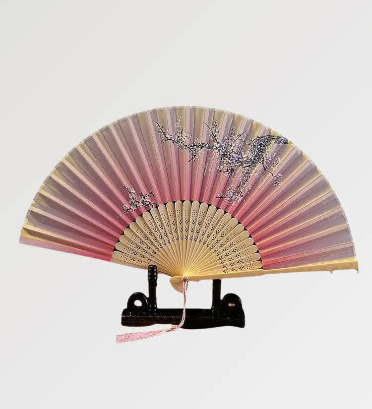 An authentic pink Japanese fan with a floral pattern