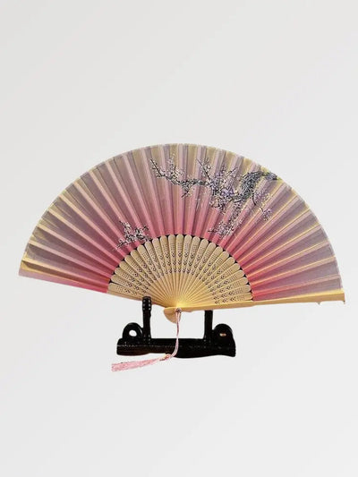 An authentic pink Japanese fan with a floral pattern