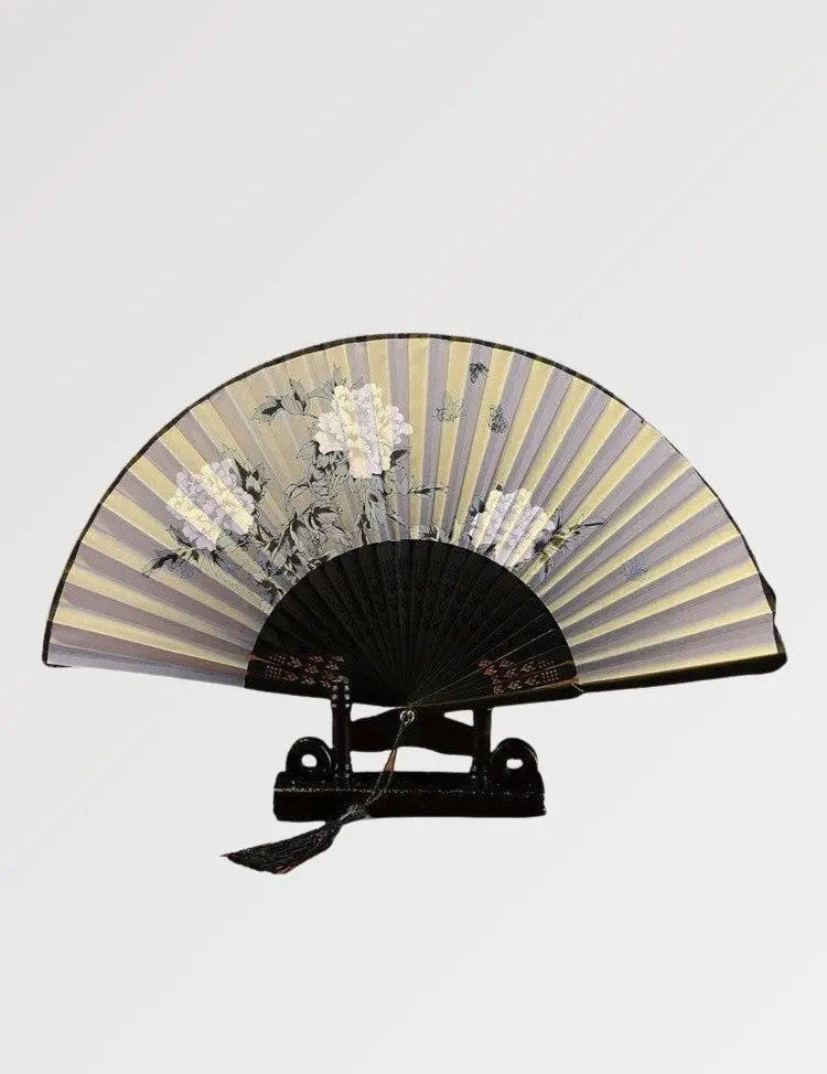 Japanese fan with white sakura flowers