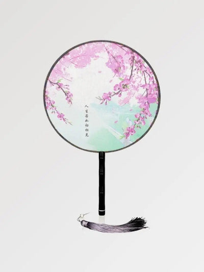 Traditional round Japanese fan with sakura pattern and Japanese calligraphy