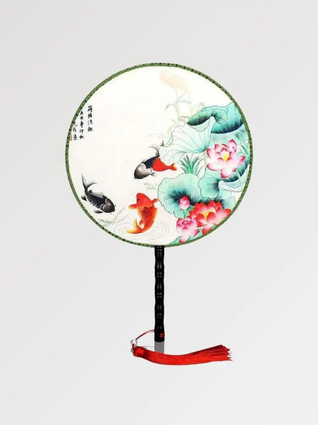 Japanese fan with round shape and fish and plants pattern
