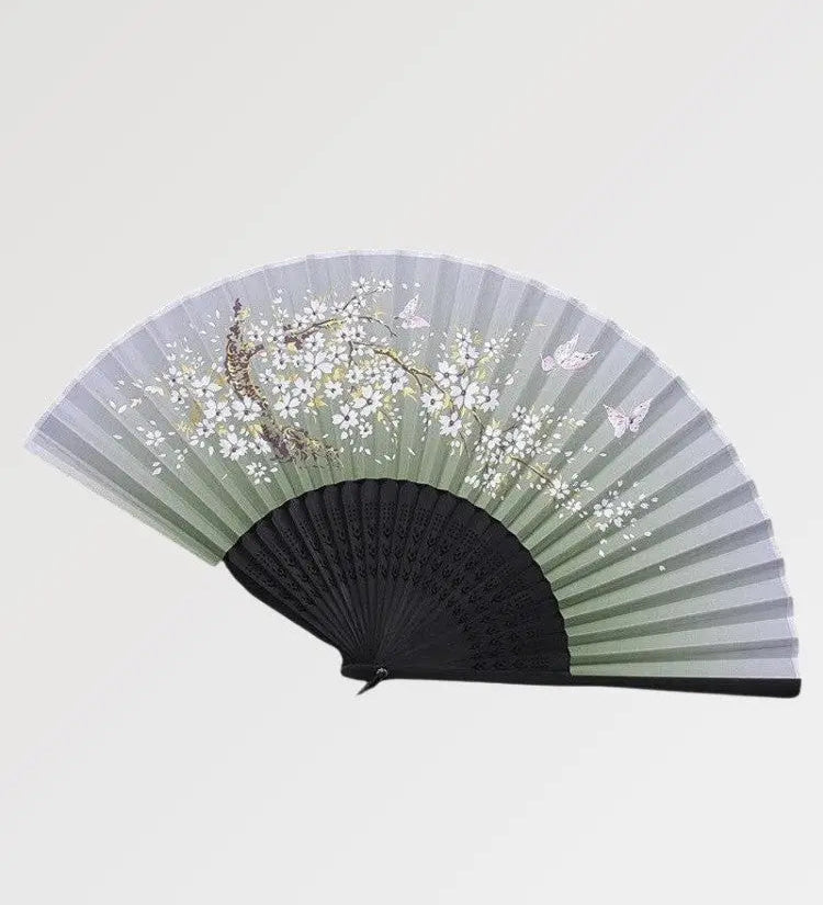 Beautiful black fan in Japanese style with sakura pattern