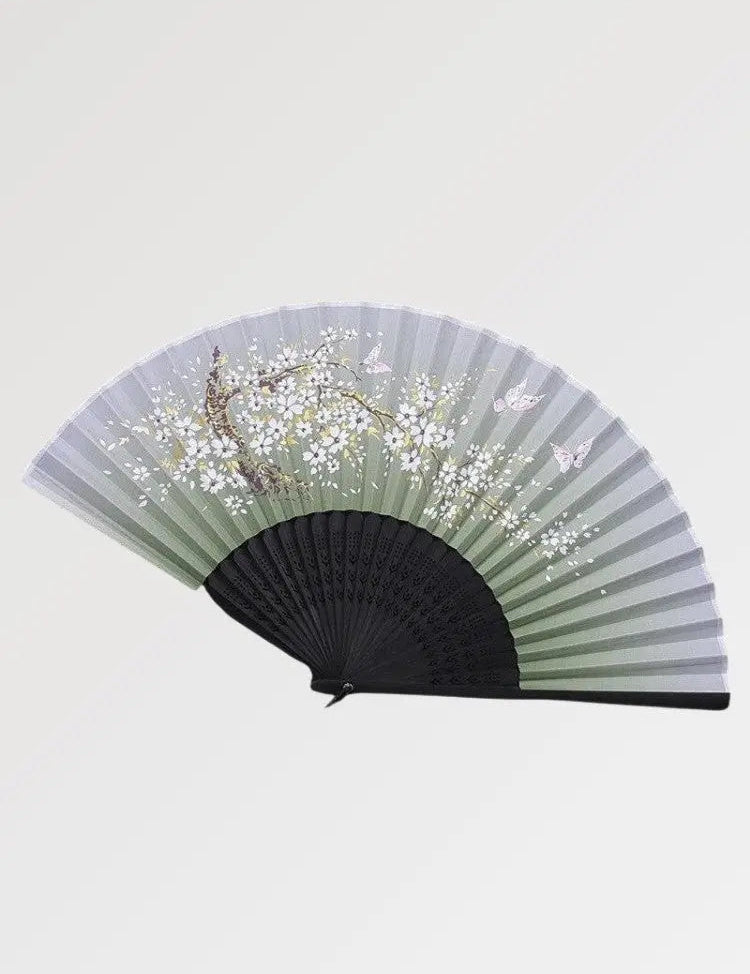Beautiful black fan in Japanese style with sakura pattern