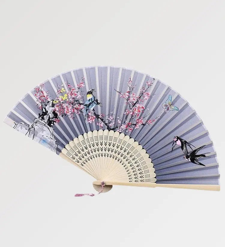 Japanese bamboo fan with iridescent flower and swallow pattern
