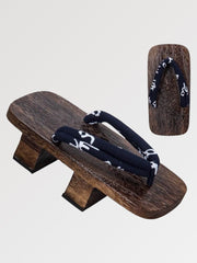 The traditional Japanese wooden sandal with its discreet patterned strap