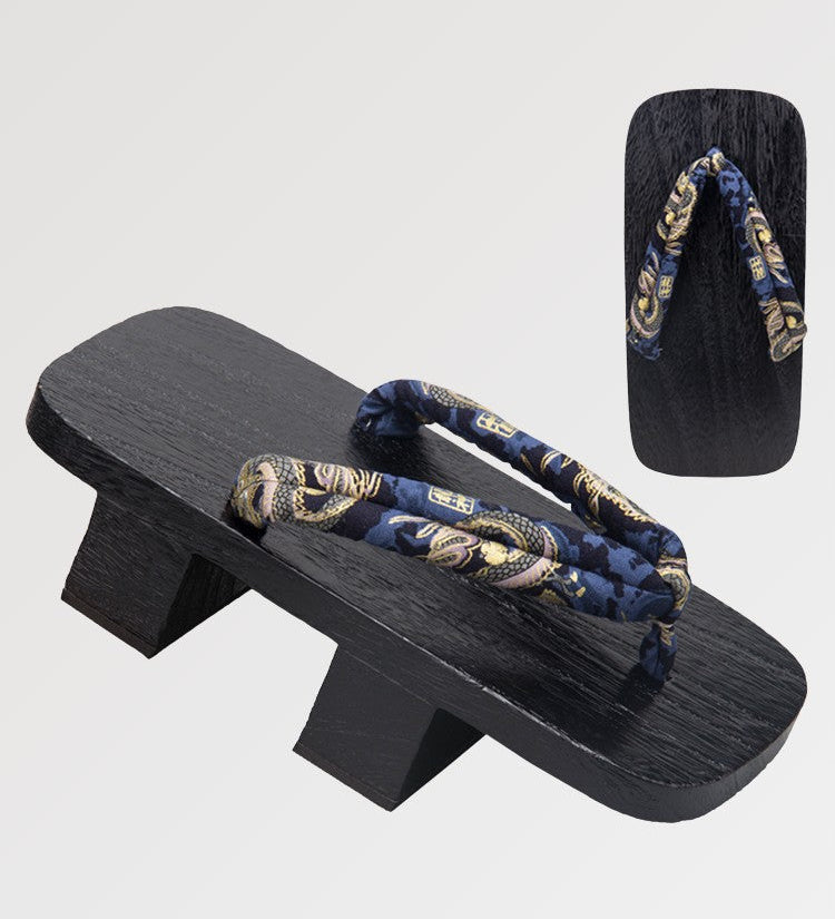 The Japanese wooden geta with a traditional pattern tinted in a deep black