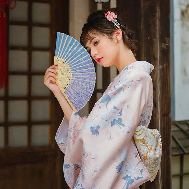 Women's Japanese Kimono embroidered in a pink color with crane pattern