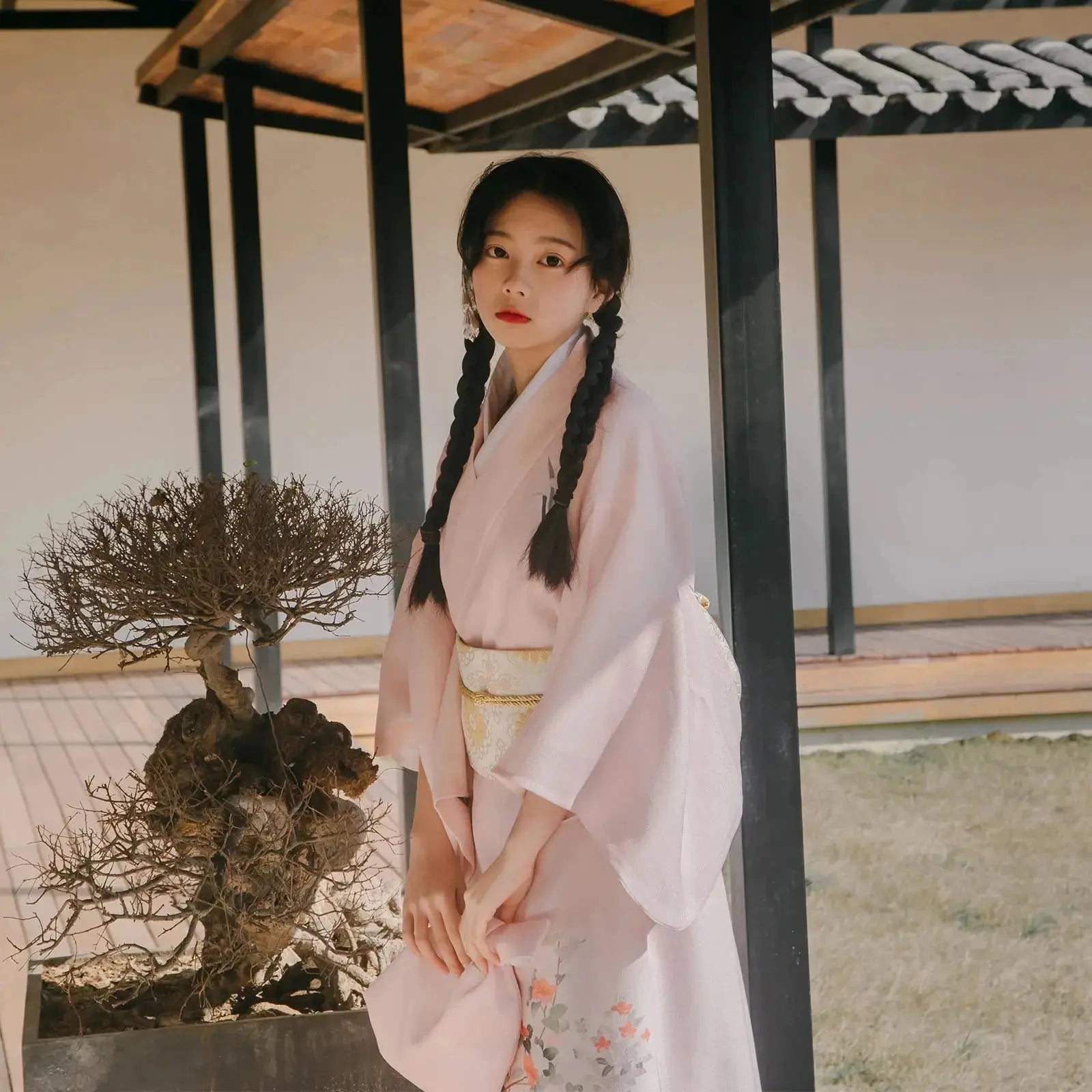 Women's Japanese Kimono in a Pink Color with flowery pattern and its traditional obi belt