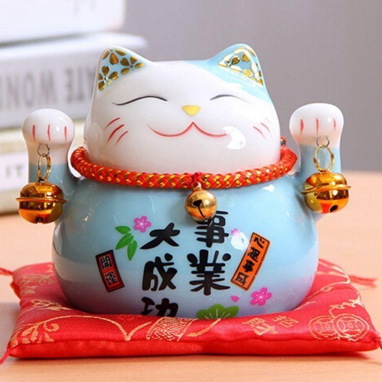 Back view of blue maneki neko figurine