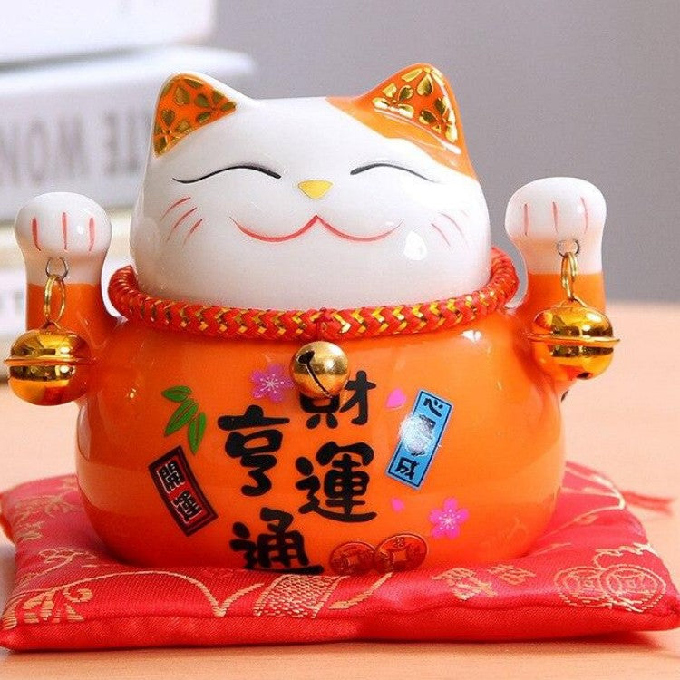 Back view of orange maneki neko figurine