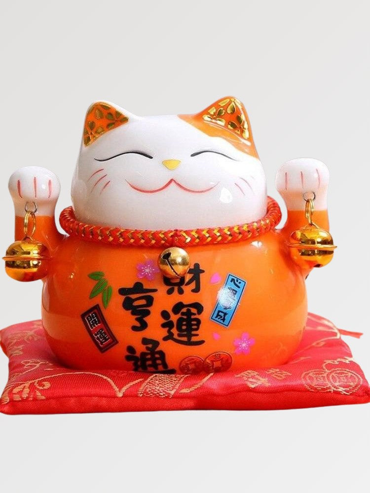 Japanese-style orange maneki neko figurine